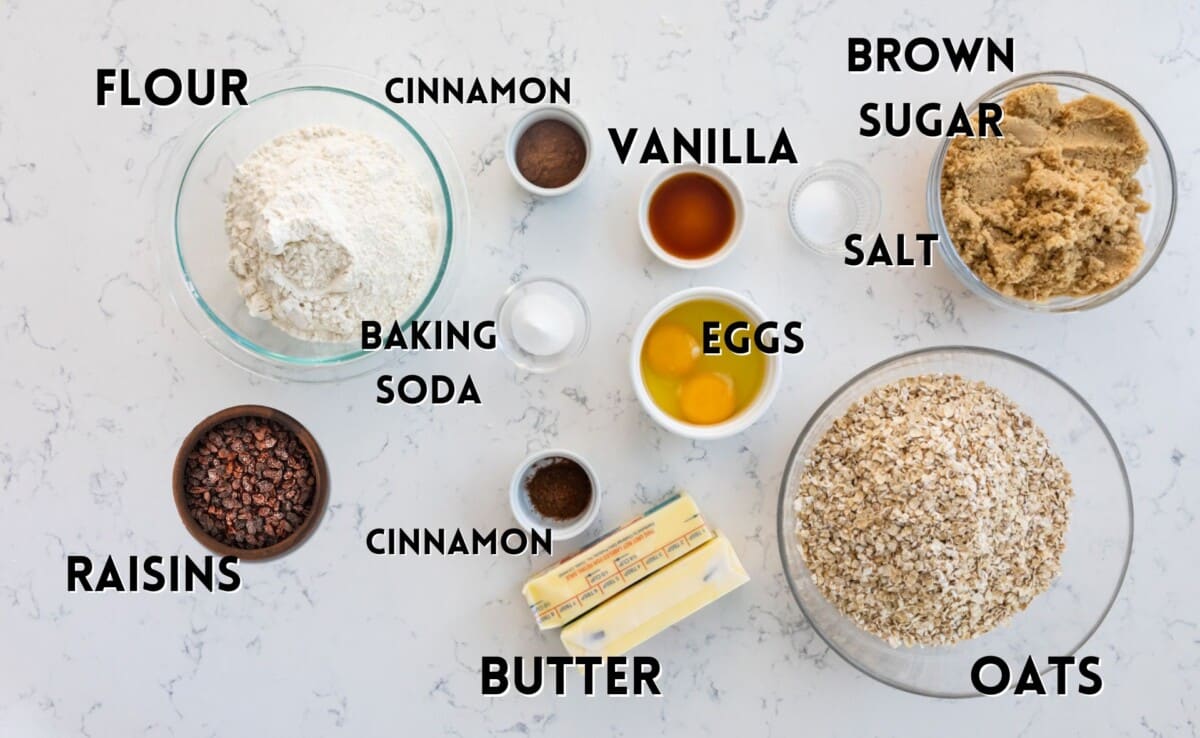 ingredients in oatmeal cookies laid out on a marble counter.