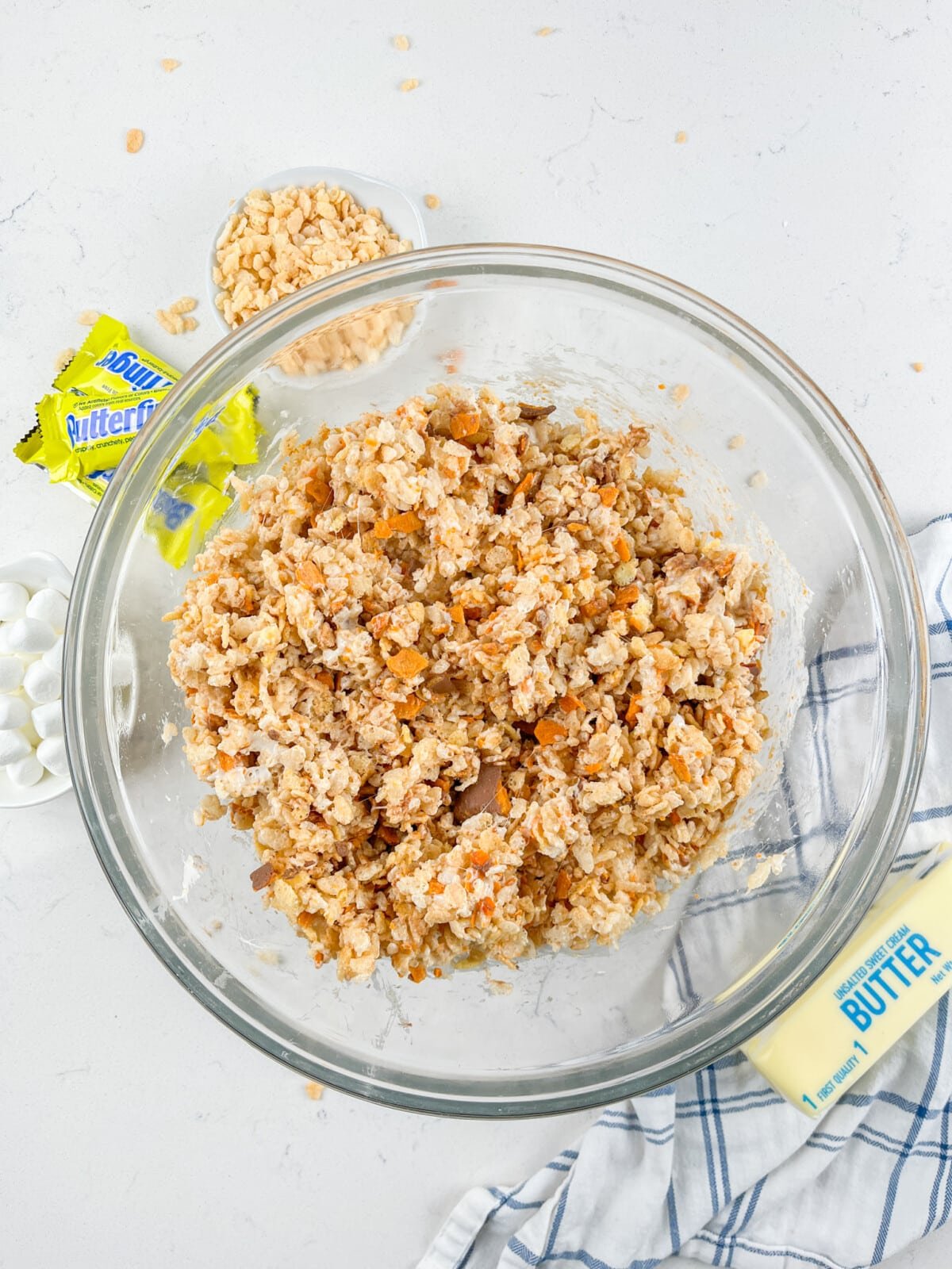 process shot of butterfinger Krispie treats being made.