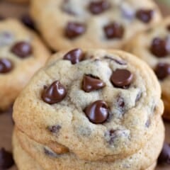 stacked chocolate chip cookies with melted chocolate chips baked in.