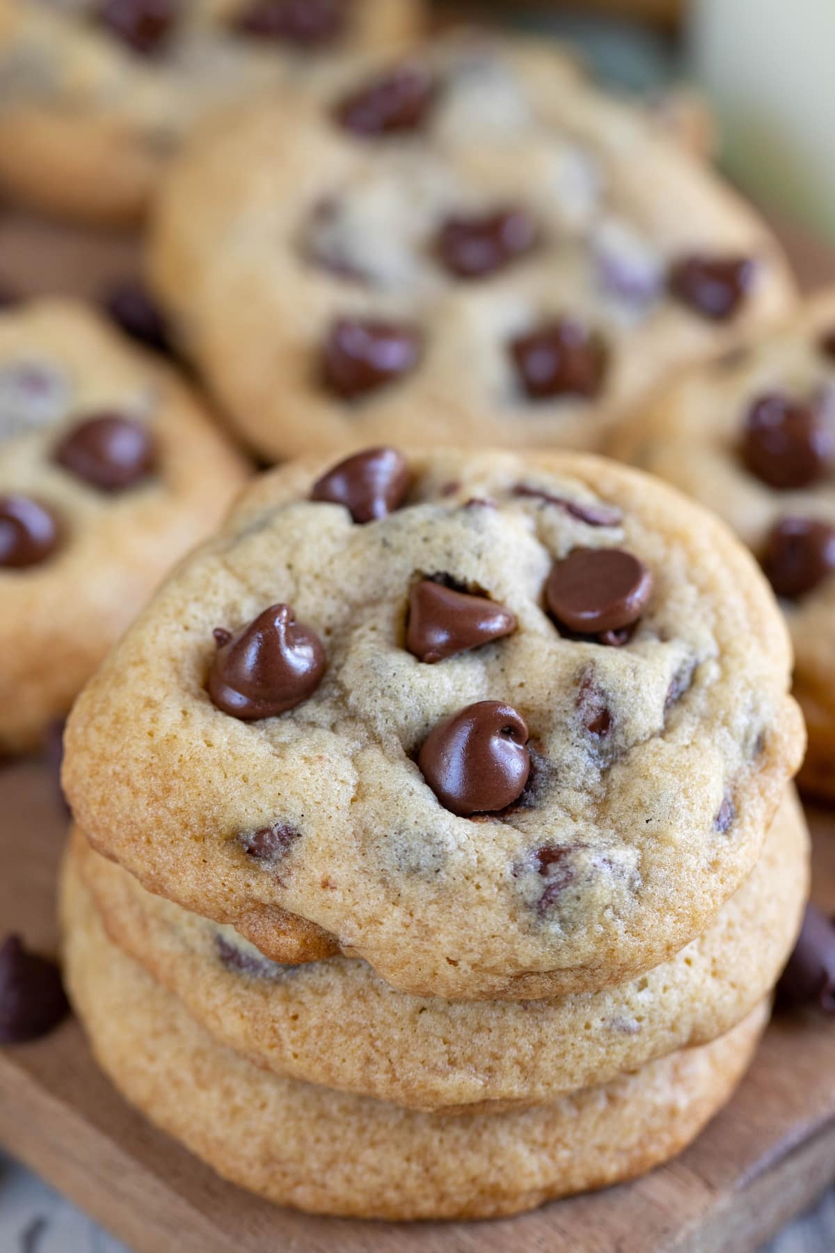stacked chocolate chip cookies with melted chocolate chips baked in.