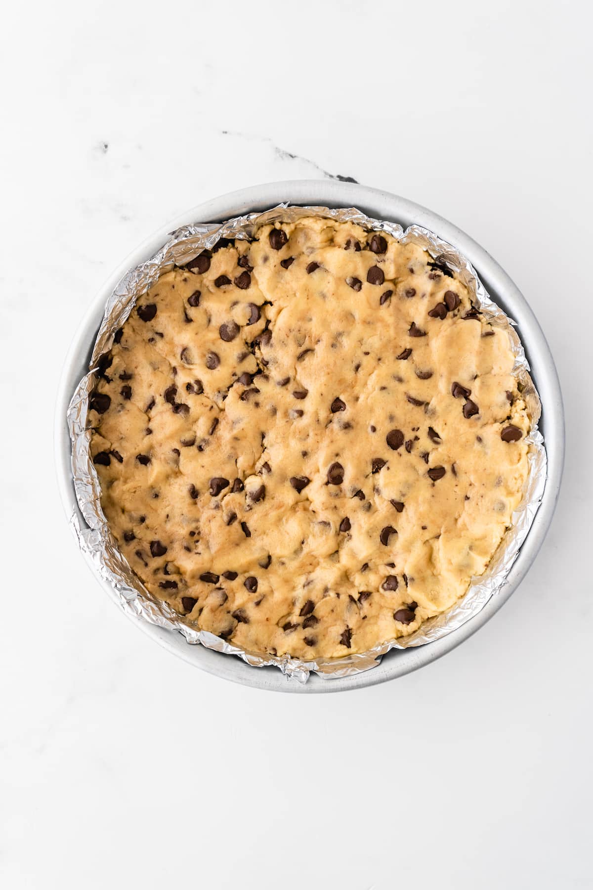 process shot of cookie cake being made.
