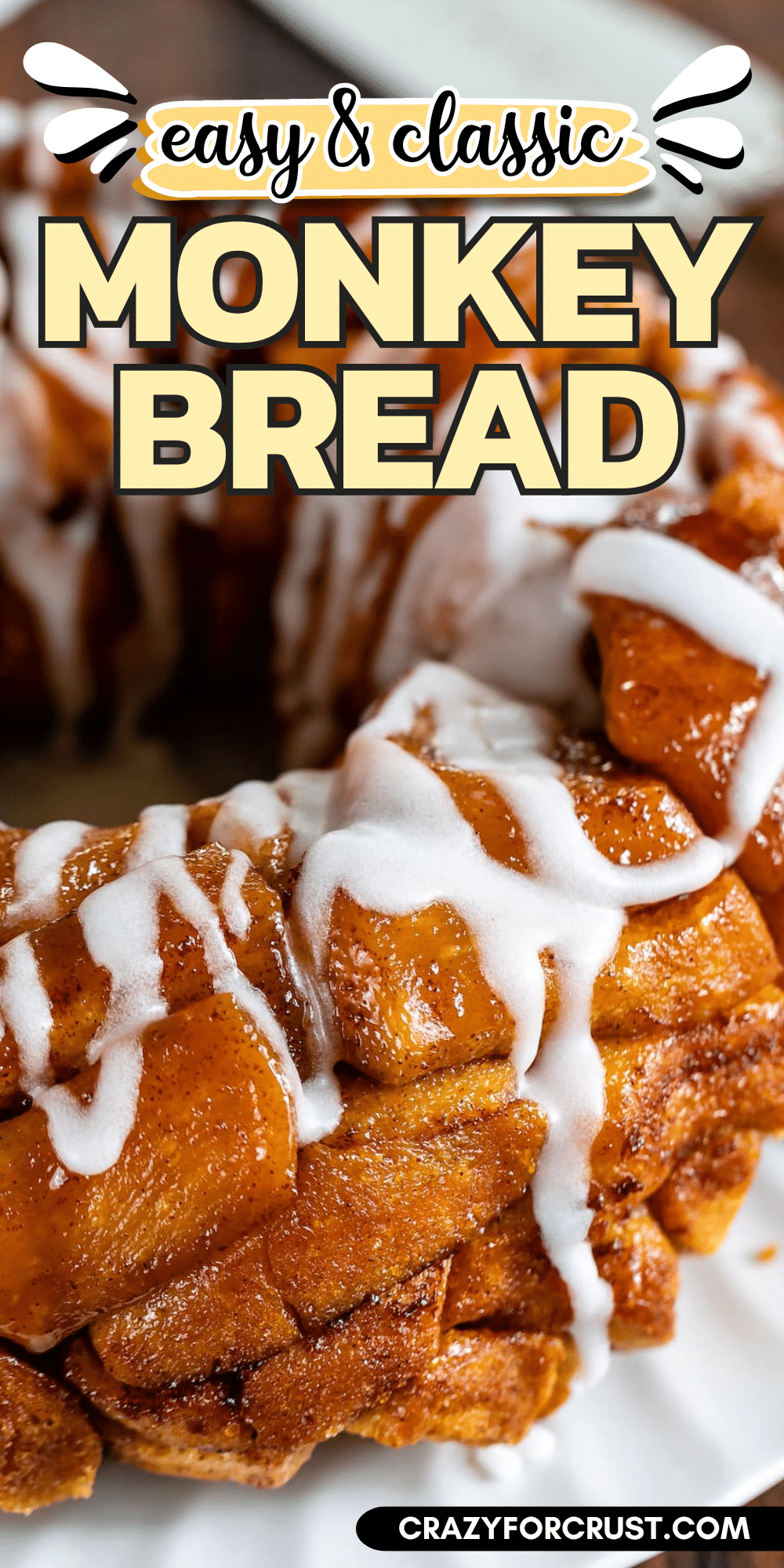 Close-up of glazed monkey bread, with shiny cinnamon-coated dough pieces and white icing drizzled on top. Text above reads Easy & Classic Monkey Bread, highlighting this easy monkey bread recipe. Website crazyforcrust.com appears at the bottom.