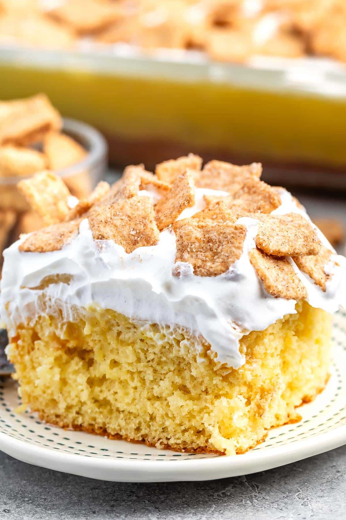 cake with white frosting and cinnamon toast crunch on top.
