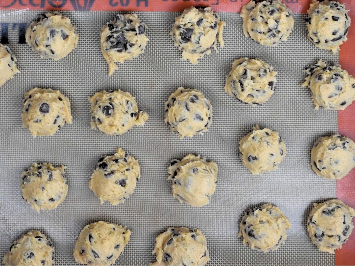 process shot of chocolate chip cookies being made.