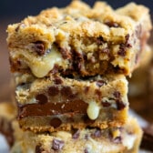 stacked gooey bars with chocolate chips baked into the center.