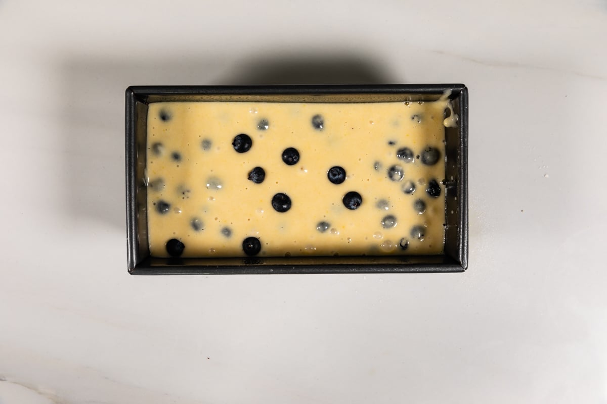process shot of blueberry bread being made.