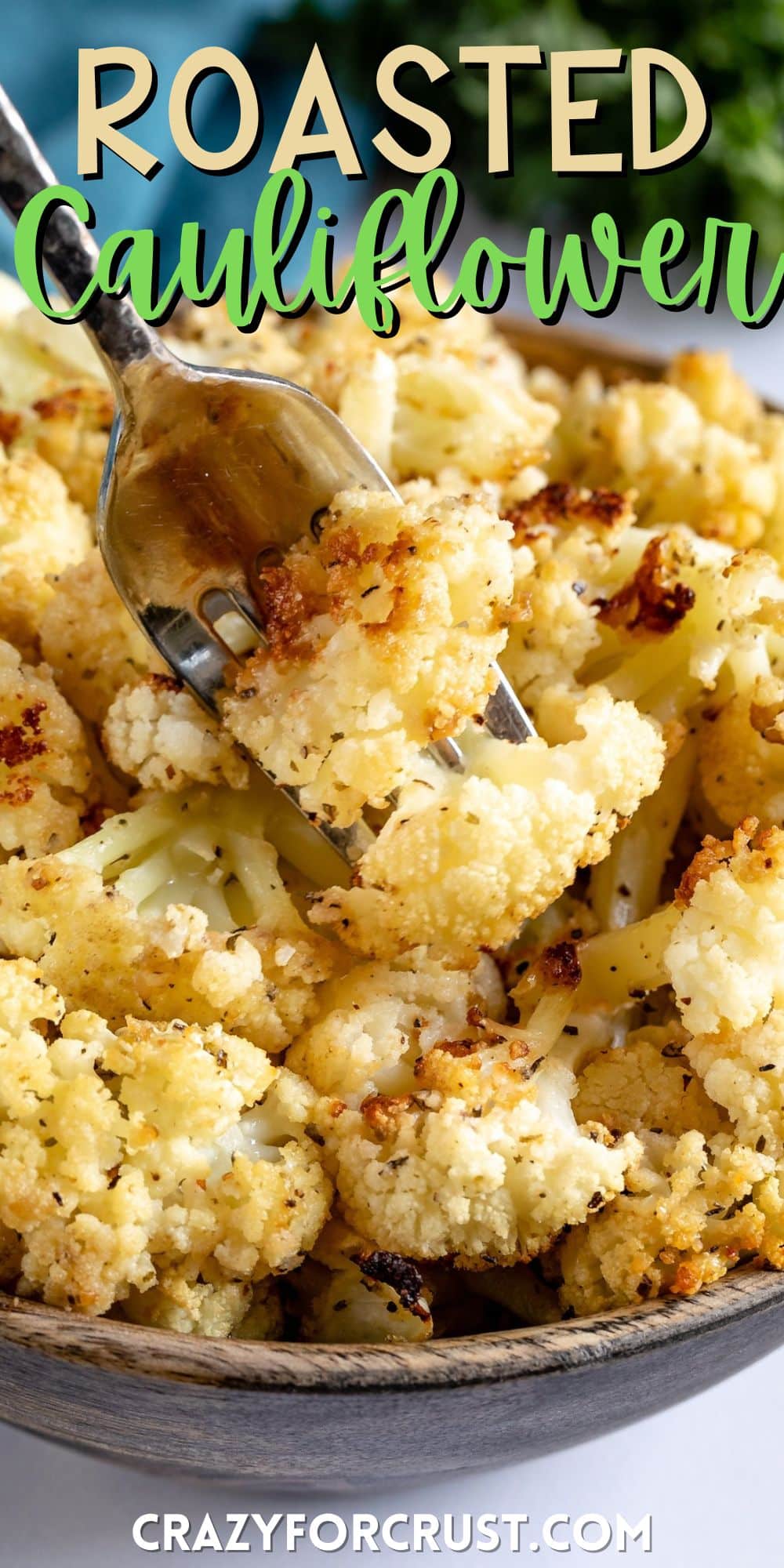 cauliflower in a wood bowl with a fork picking up some pieces with words on the image.