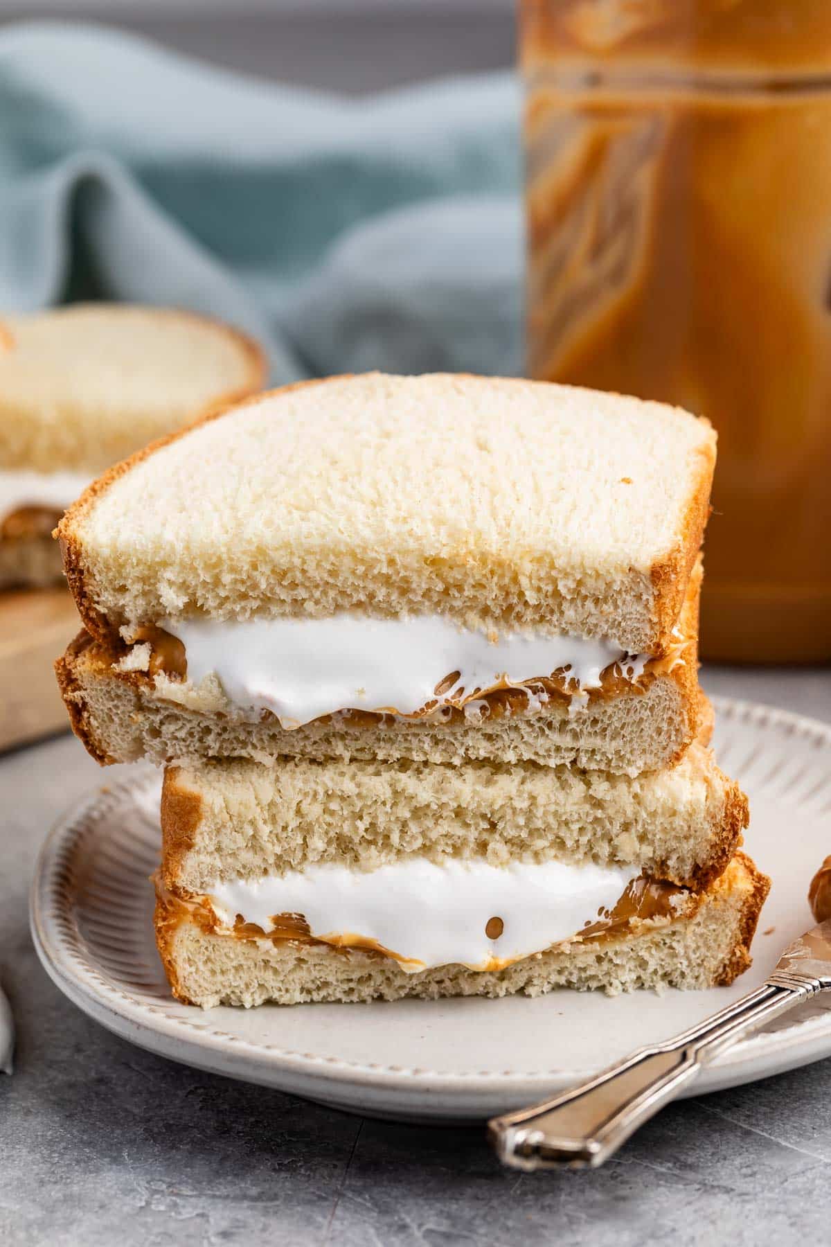 stacked sandwich halves with peanut butter and marshmallow fluff on the inside.