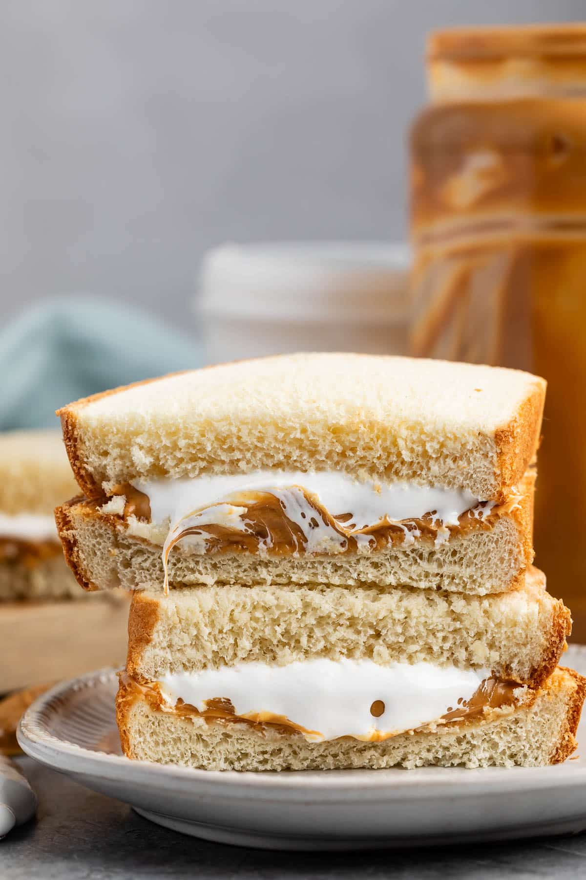 stacked sandwich halves with peanut butter and marshmallow fluff on the inside.