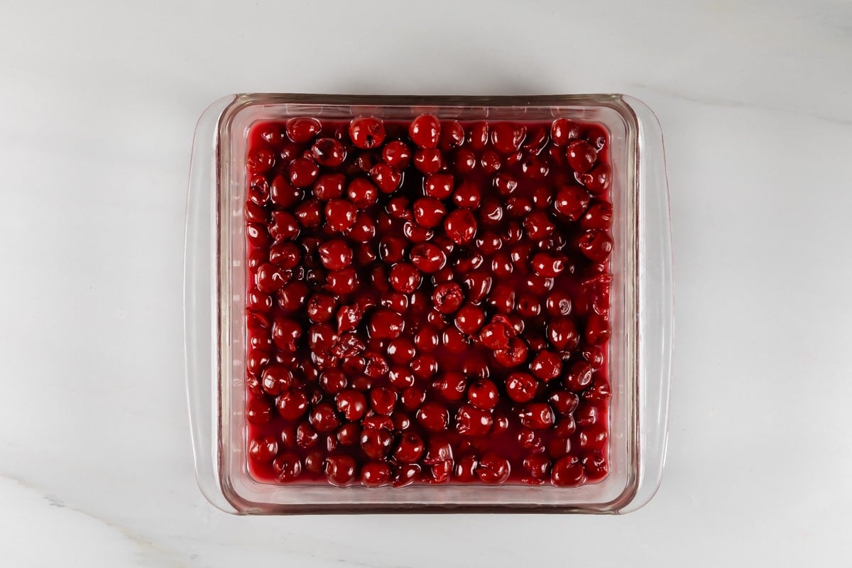 process shot of tart cherry cobbler being made.