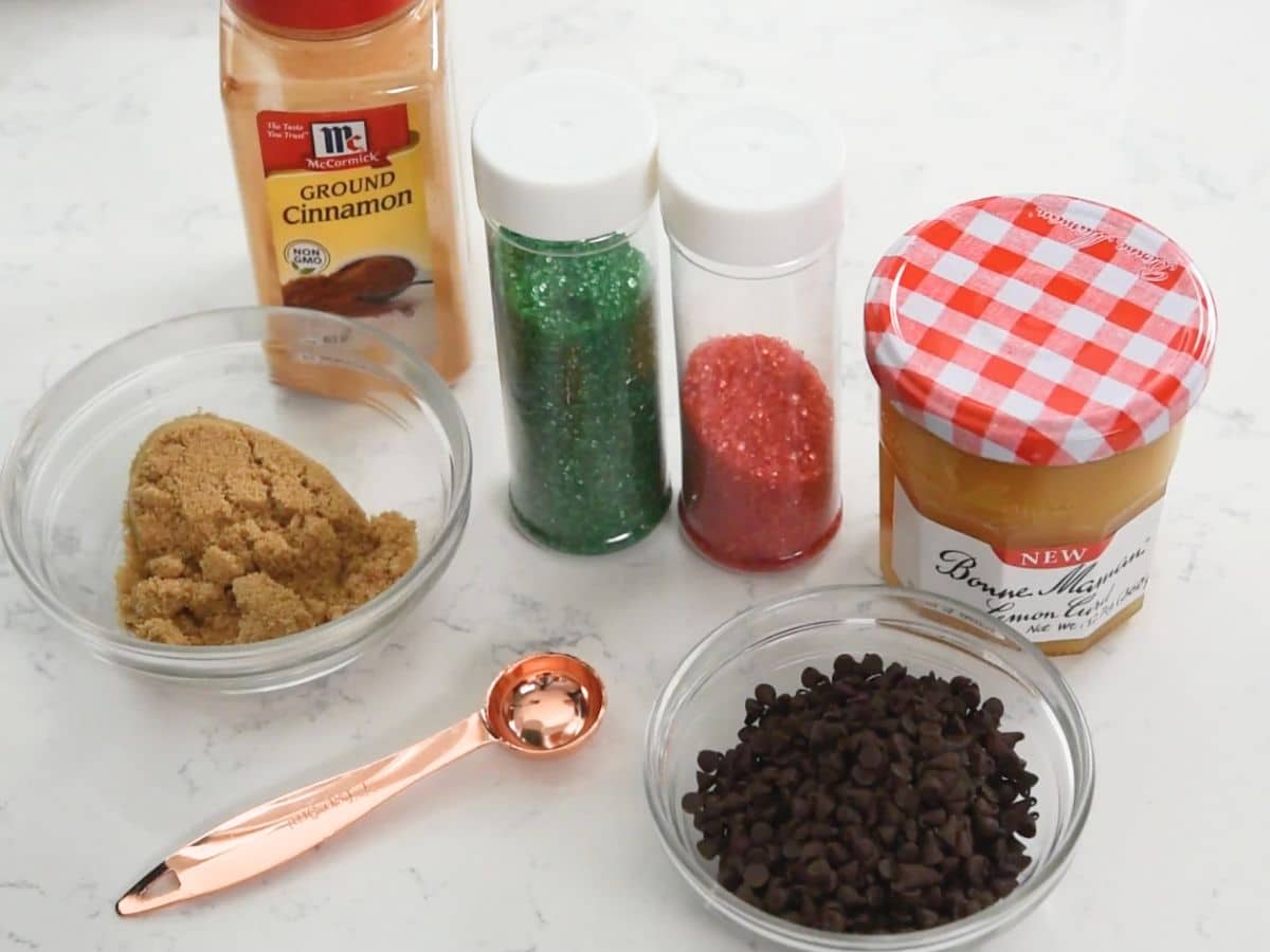 ingredients in spiral cookies laid out on a white marble countertop.