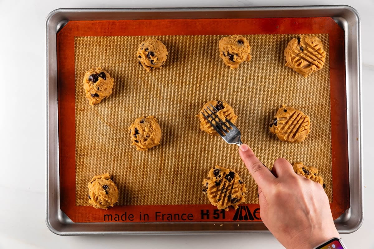 process shot of peanut butter chocolate chip cookies being made.