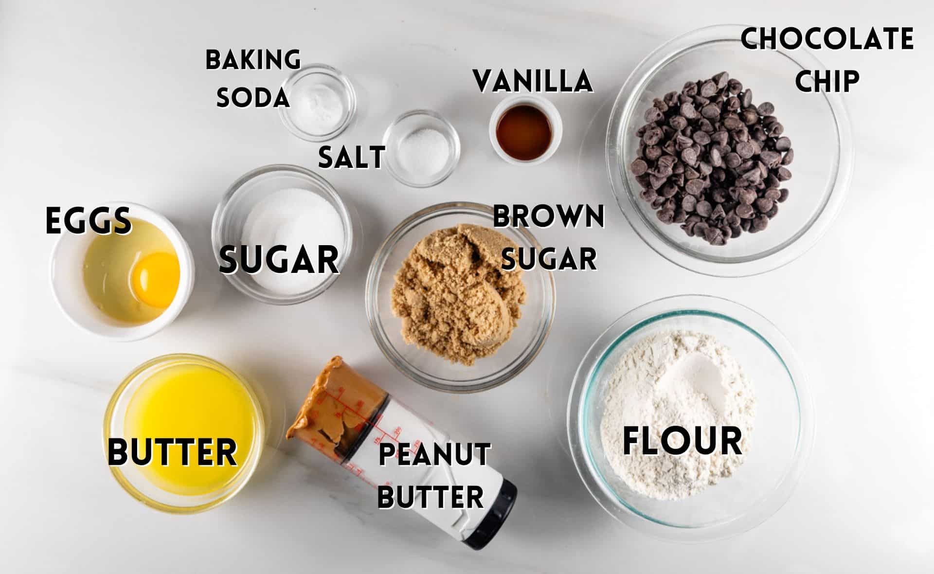 ingredients in peanut butter cookies laid out in a white counter.
