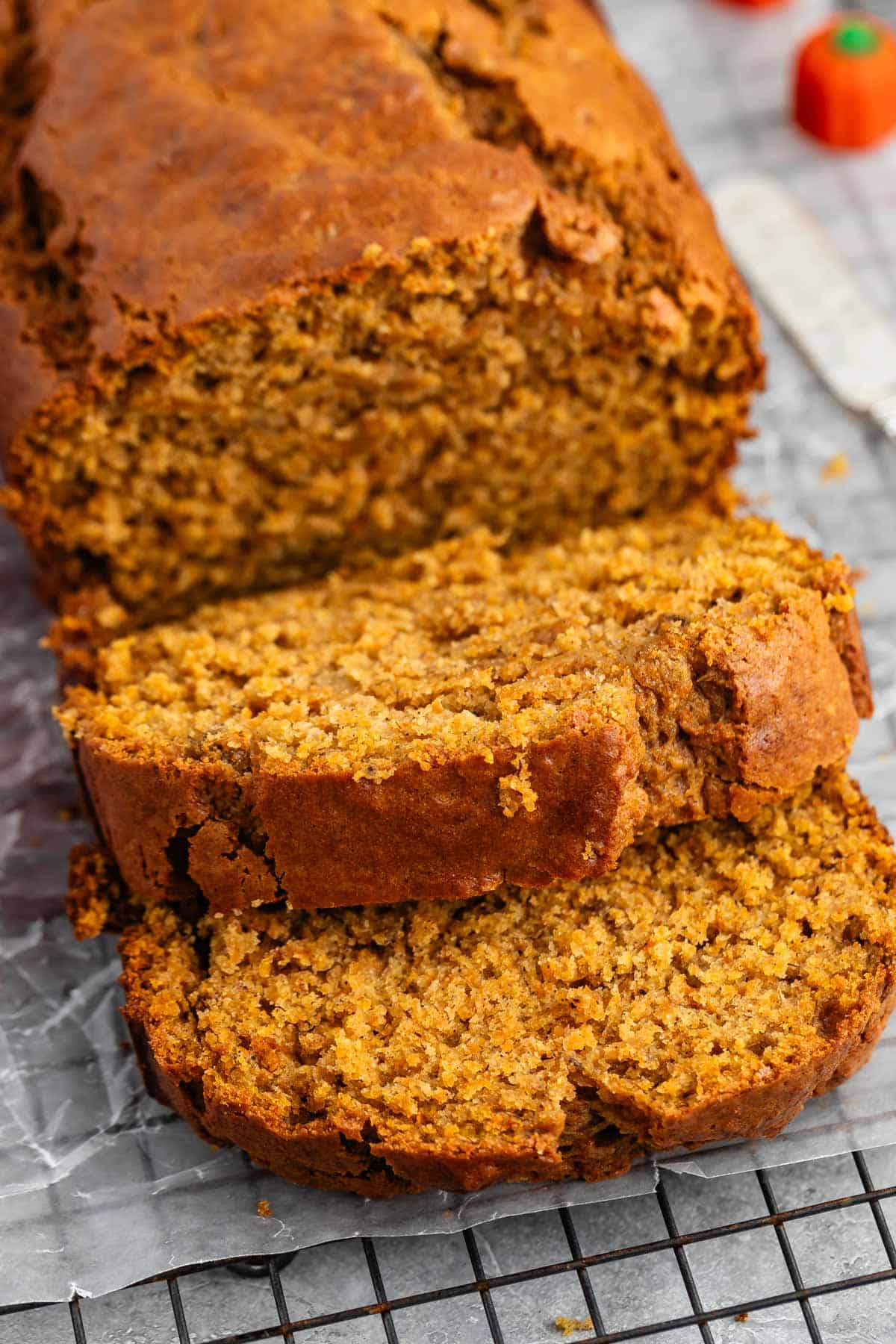 sliced banana bread on a drying rack.