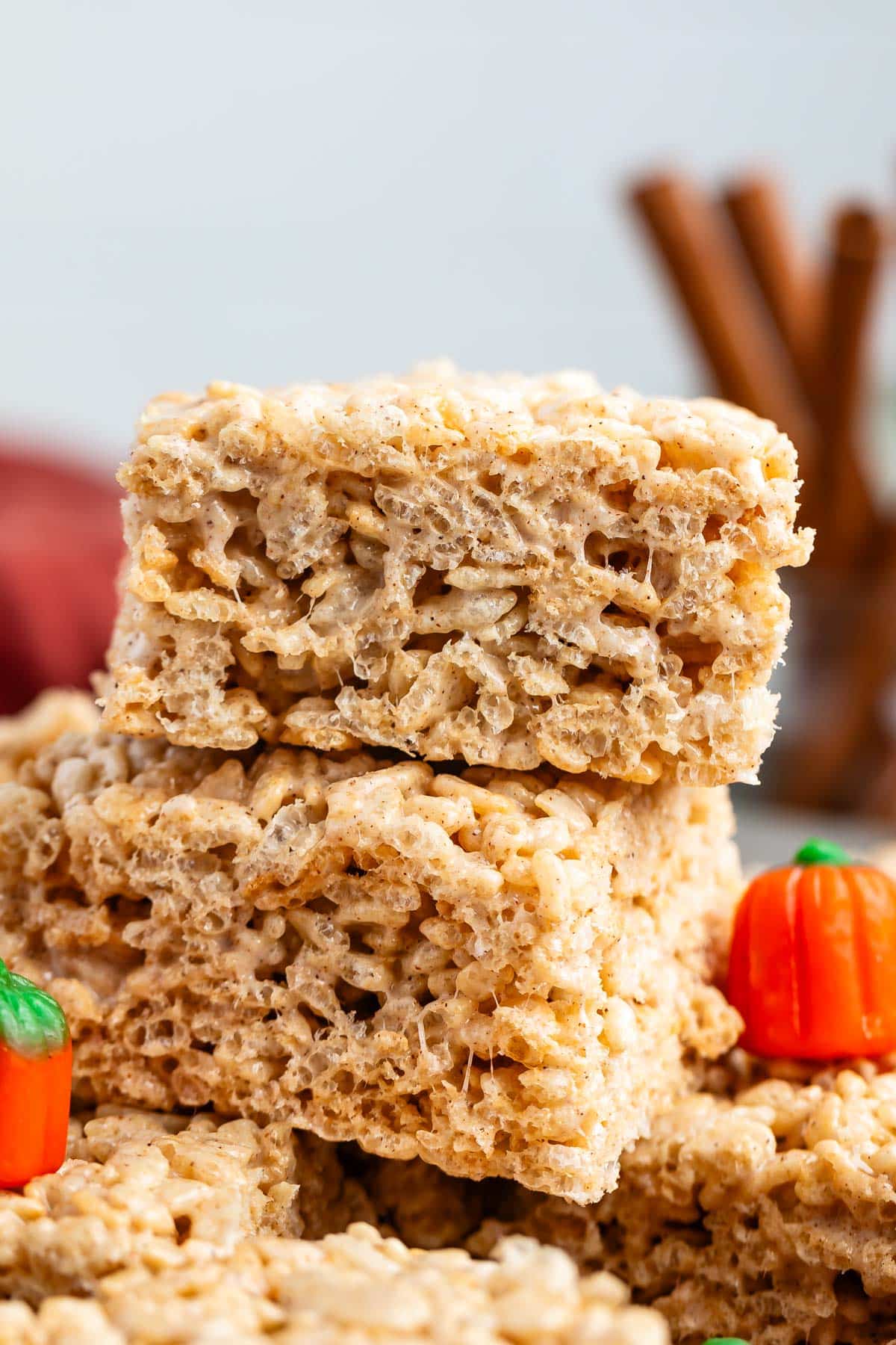 stacked Rice Krispie treats surrounded by pumpkin candy corn.