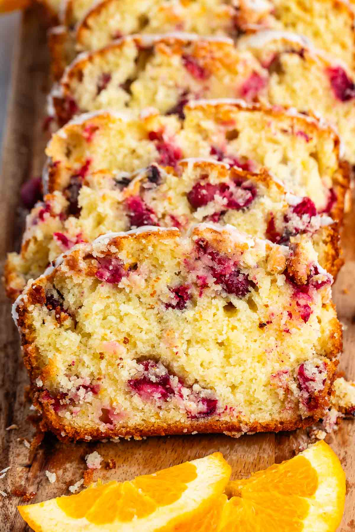 sliced cranberry bread on a cutting board.