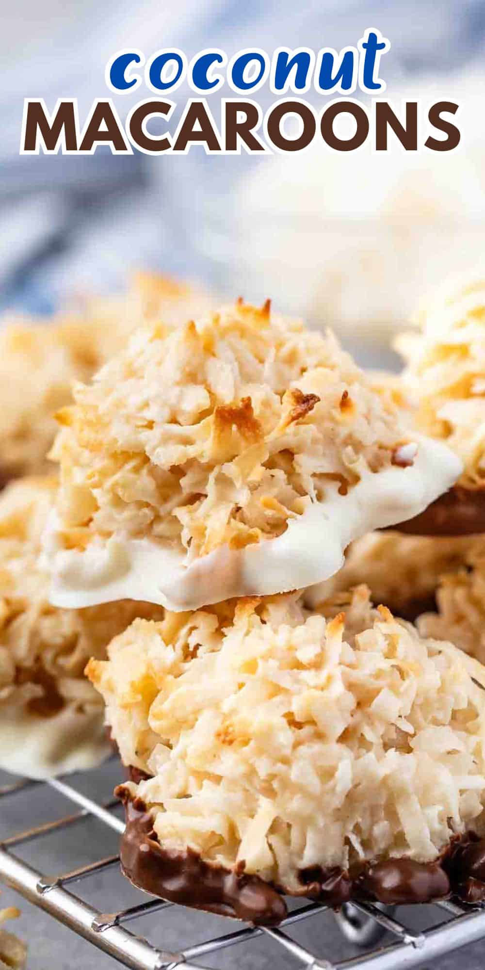 Close-up of coconut macaroons on a cooling rack. The macaroons are golden-brown with toasted coconut flakes and have a chocolate coating at the base. The text Coconut Macaroons is visible at the top.