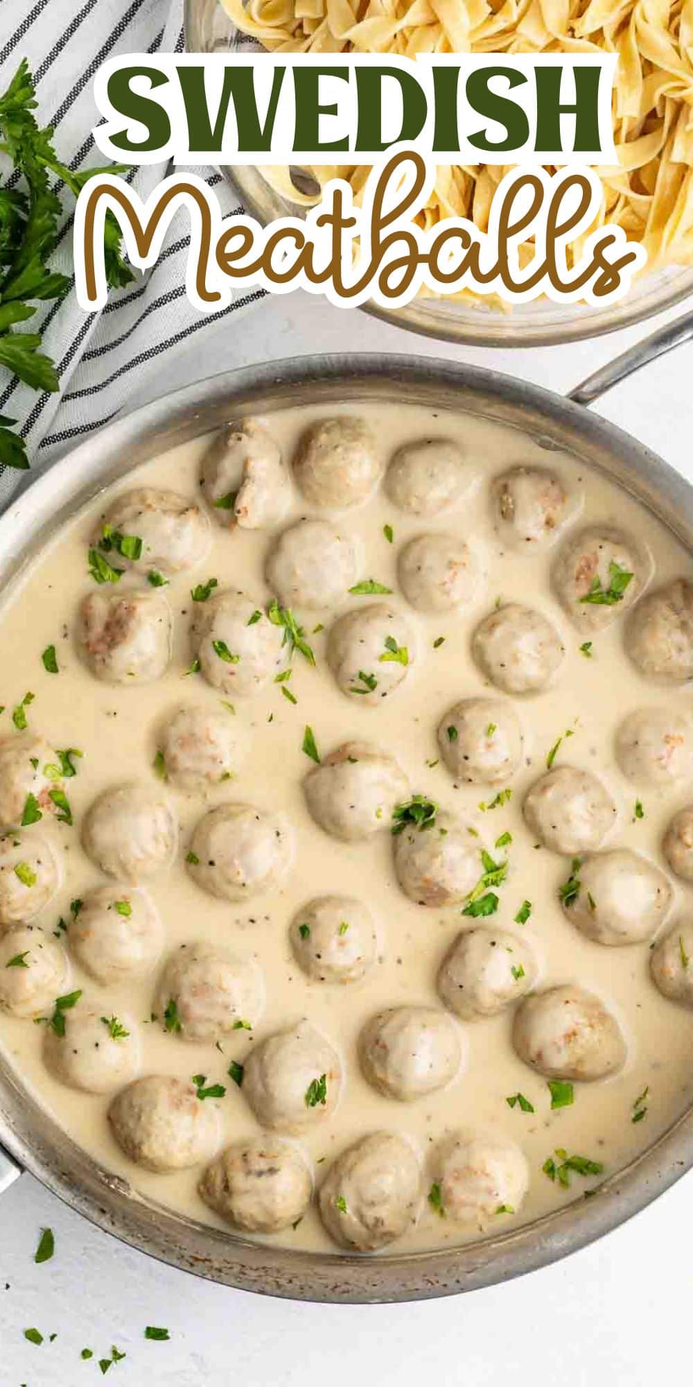A pan filled with Swedish meatballs in creamy sauce, garnished with chopped parsley. To the side are uncooked pasta ribbons and sprigs of fresh parsley. The text Swedish Meatballs is displayed at the top of the image.