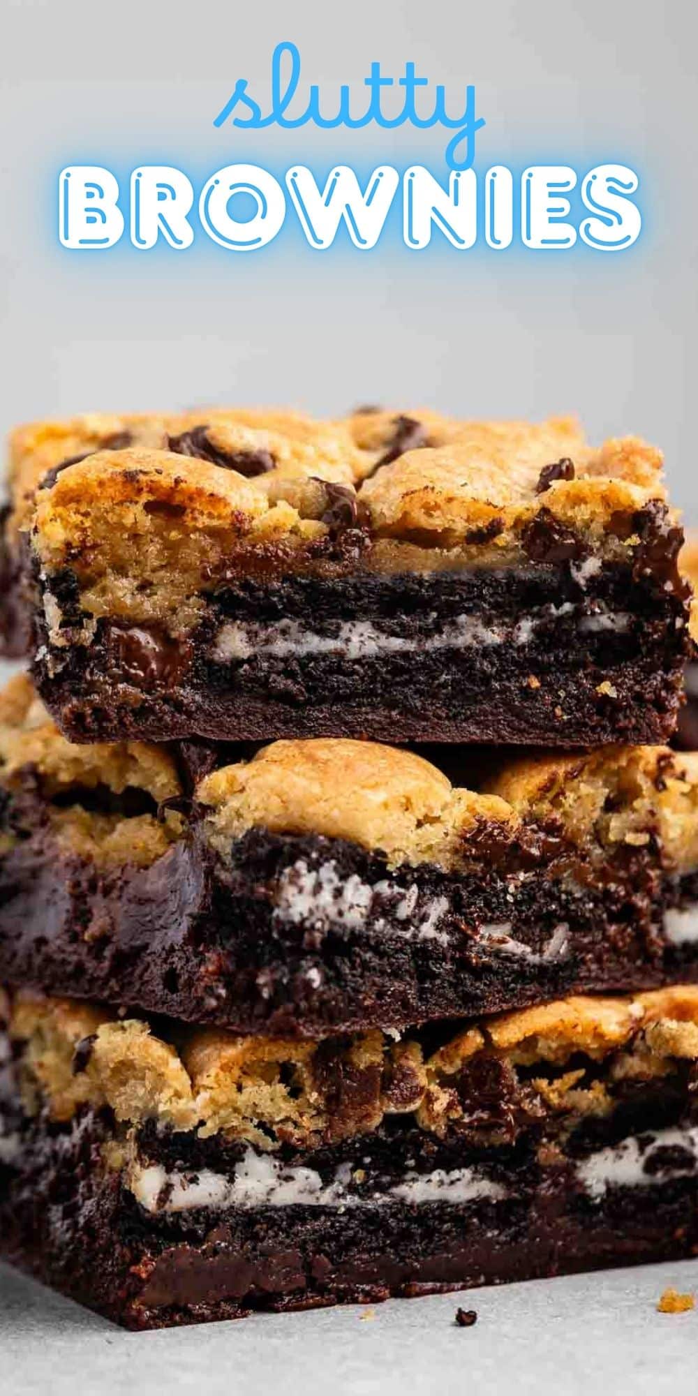 Three stacked slutty brownies, each with layers of chocolate chip cookie dough, Oreo cookies, and fudgy brownie, with the words slutty brownies in blue text at the top.