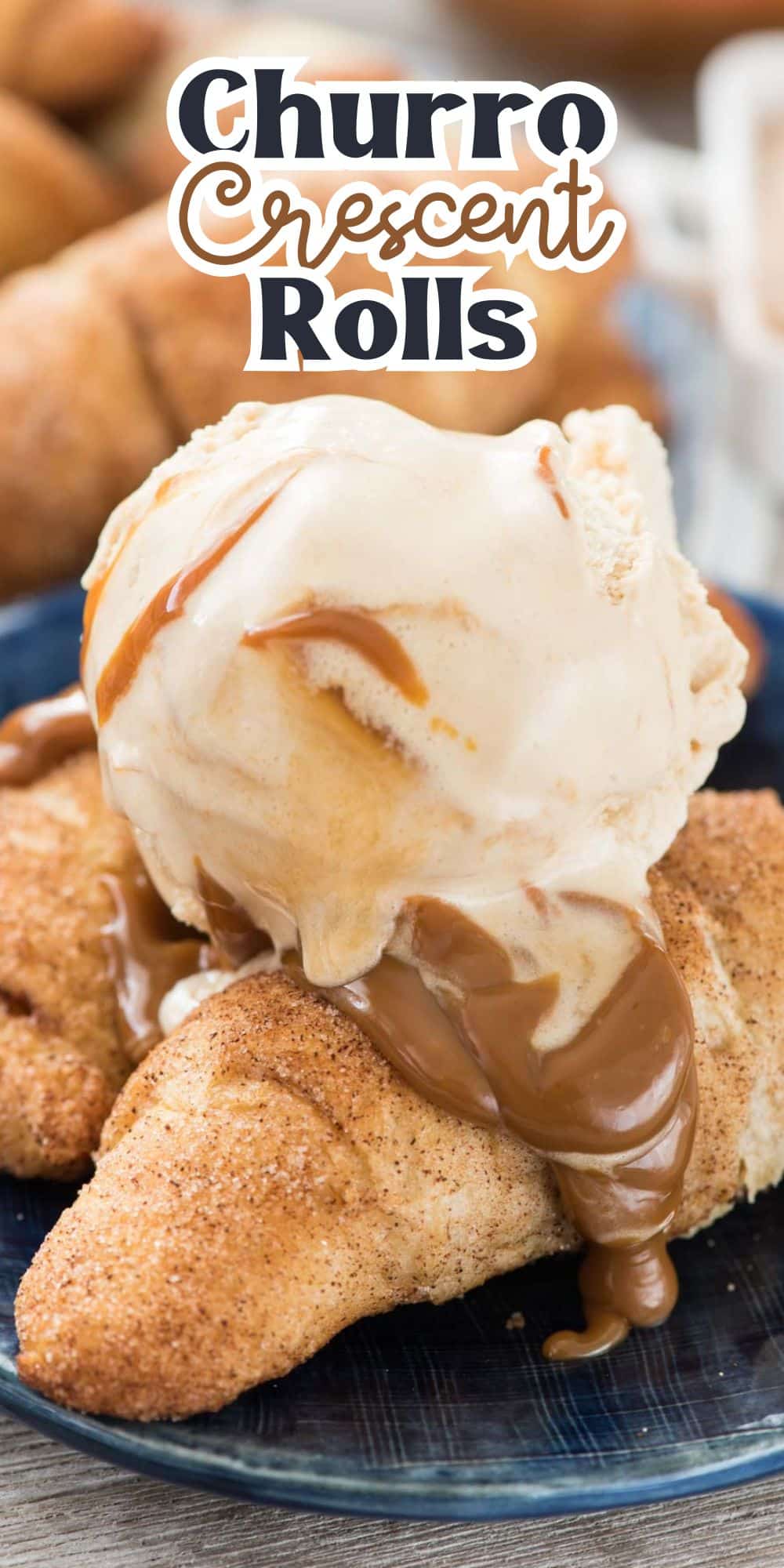 A churro crescent roll topped with a scoop of vanilla ice cream and a drizzle of caramel sauce, placed on a blue plate. The text Churro Crescent Rolls is displayed at the top of the image.