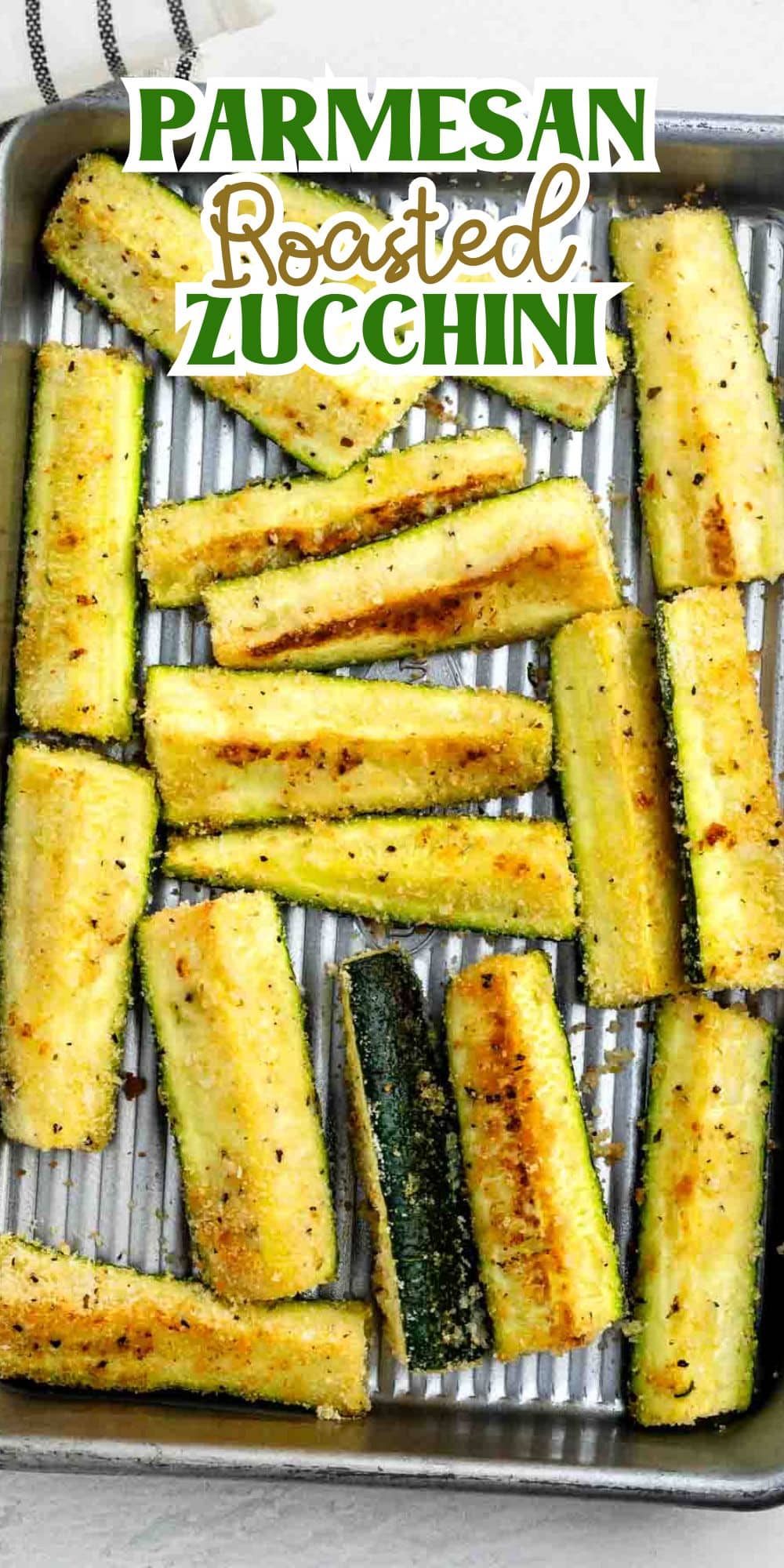 A tray of golden-brown roasted zucchini spears coated in parmesan cheese, arranged on a metal baking sheet. The text Parmesan Roasted Zucchini is displayed at the top of the image.