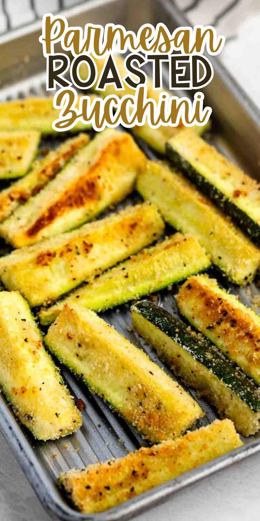 A baking tray filled with golden-brown, crispy parmesan roasted zucchini sticks. The image has text on top that reads Parmesan Roasted Zucchini in bold, decorative font.