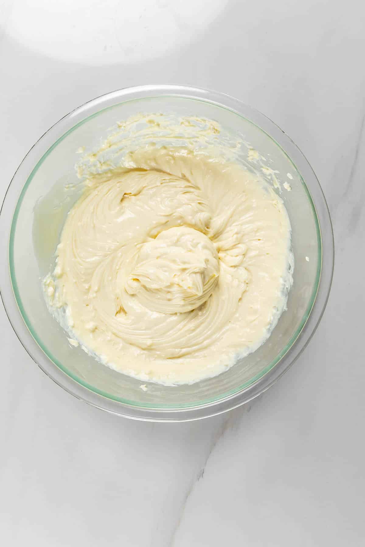 process shot of no bake cheesecake being made.