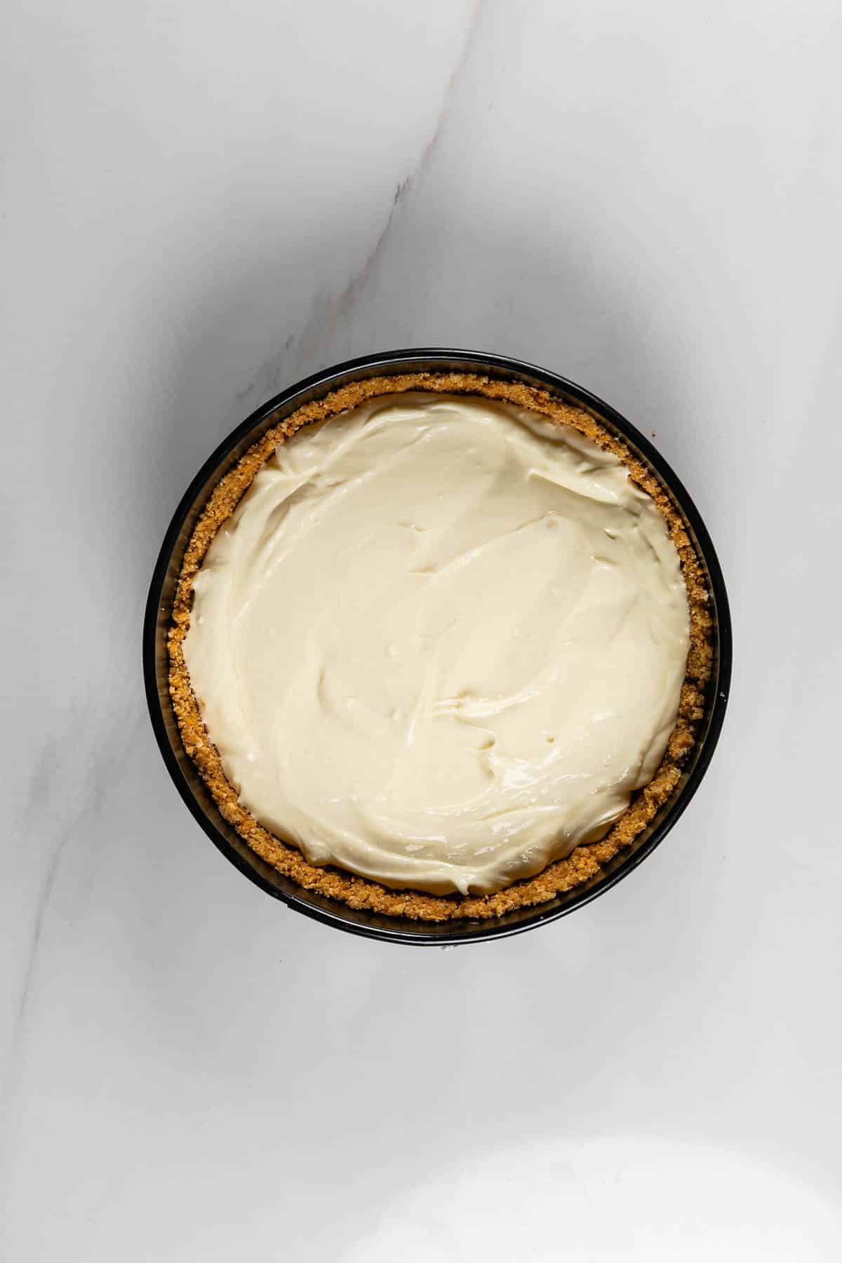 process shot of no bake cheesecake being made.