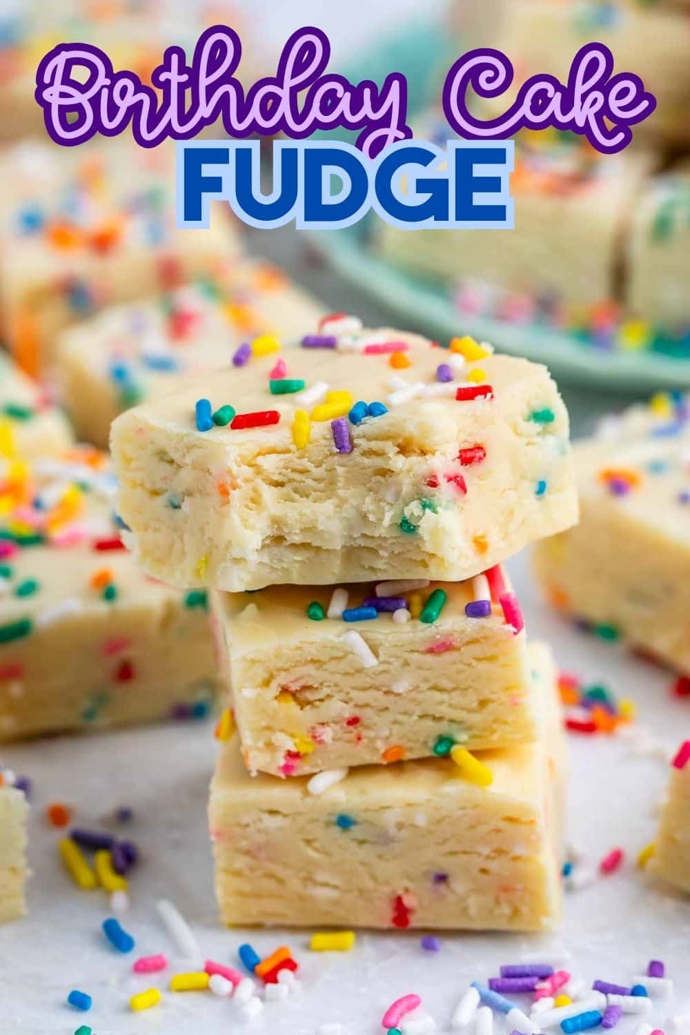 Three stacked pieces of birthday cake fudge with colorful sprinkles, surrounded by more fudge pieces and sprinkles, with text “Birthday Cake Fudge” at the top.