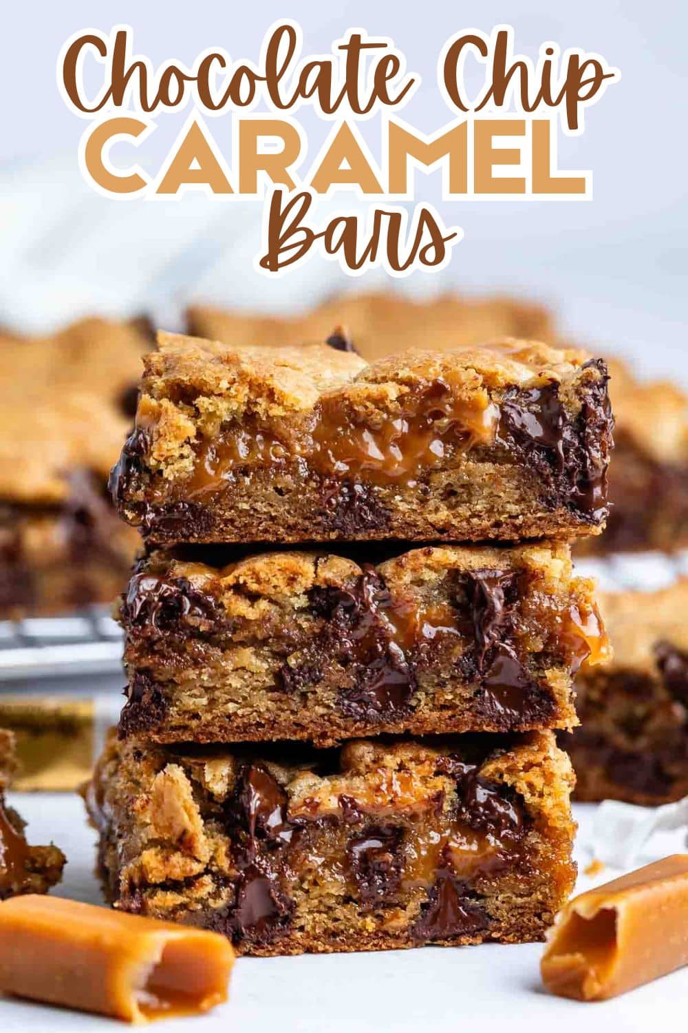 Three chocolate chip caramel bars are stacked, showing gooey caramel and melted chocolate chips inside. Extra caramel pieces and more bars are scattered in the background. The text reads Chocolate Chip Caramel Bars.