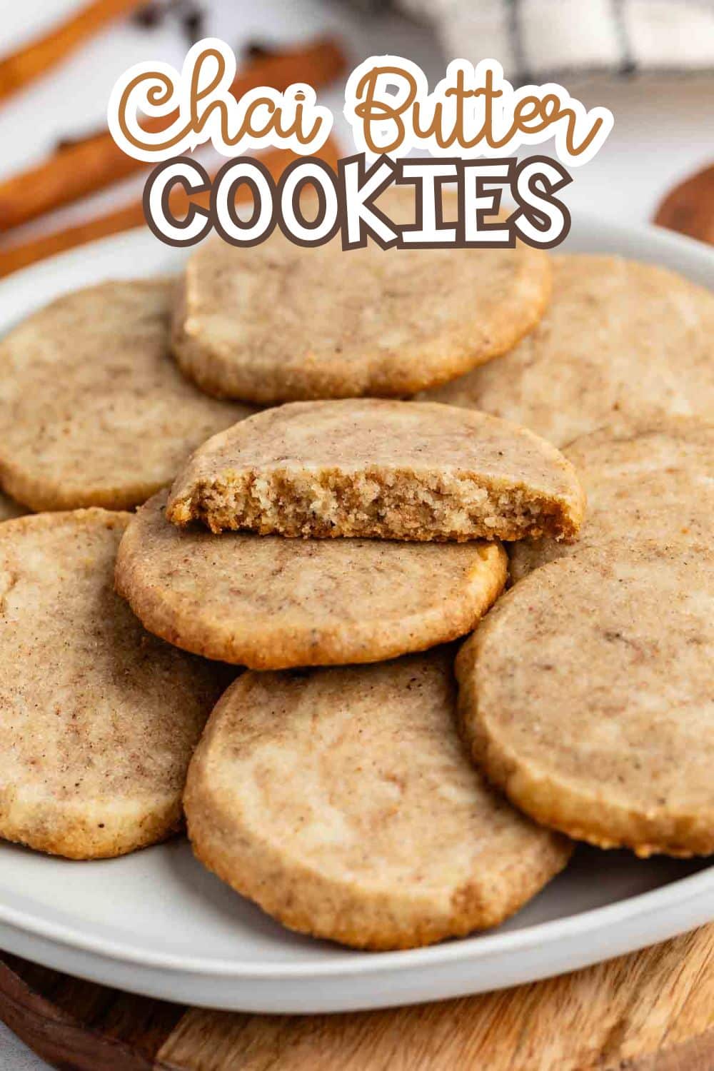 stacked brown chai cookies on a grey plate with words on the image reading the name of the recipe.
