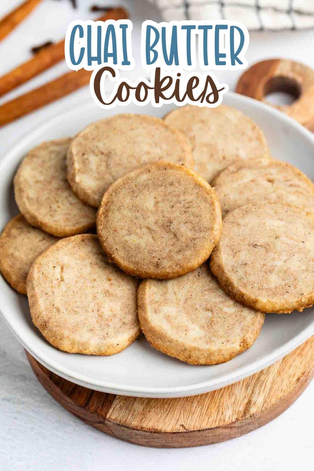 stacked brown chai cookies on a grey plate with words on the image reading the name of the recipe.