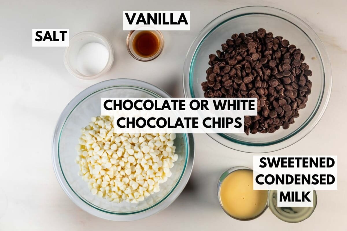 Top view of four clear bowls containing salt, vanilla extract, chocolate or white chocolate chips, and sweetened condensed milk, each labeled with bold text on a white background.