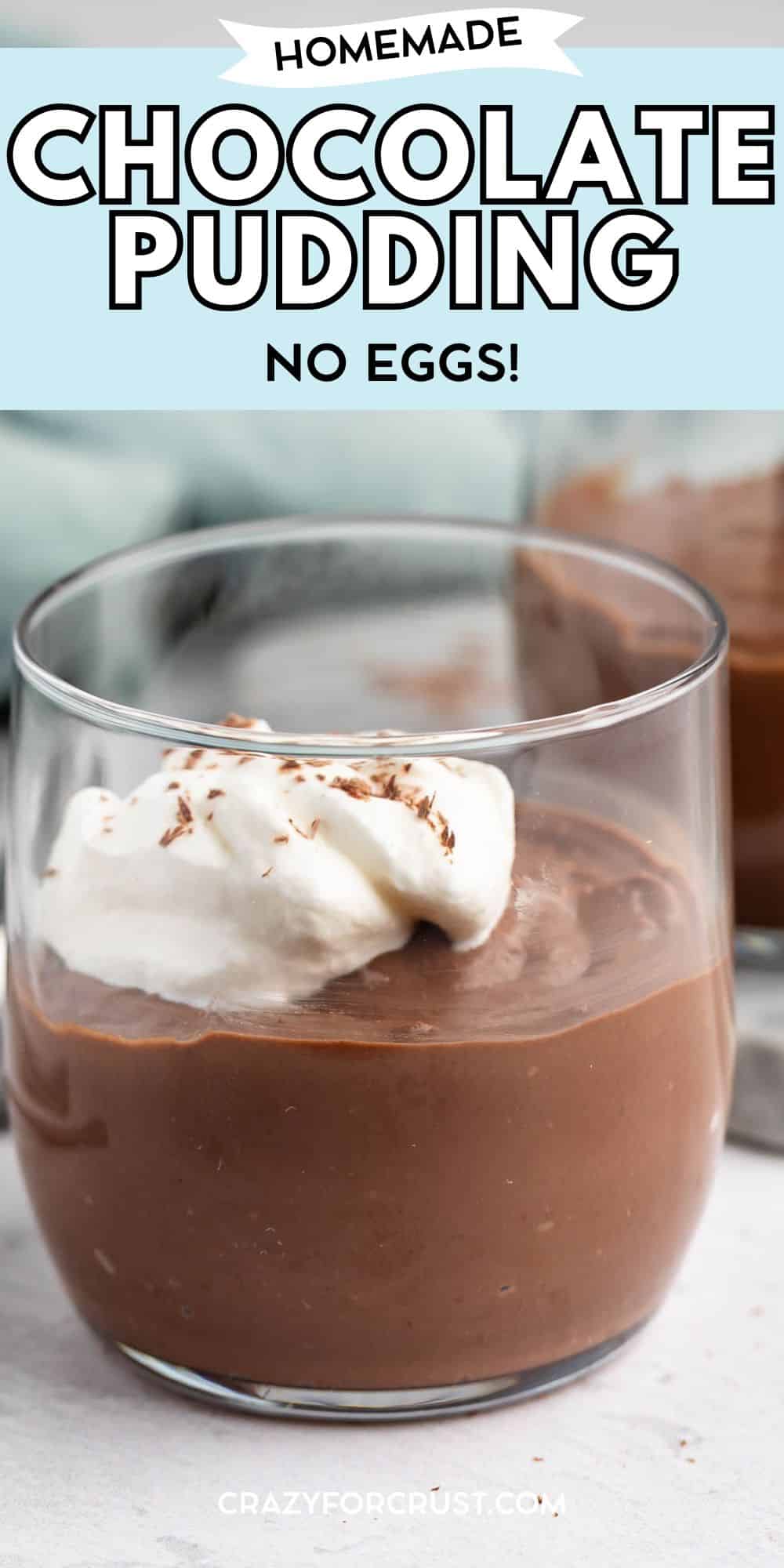 A glass filled with homemade chocolate pudding topped with whipped cream and chocolate shavings; text above reads “Homemade Chocolate Pudding No Eggs!”.