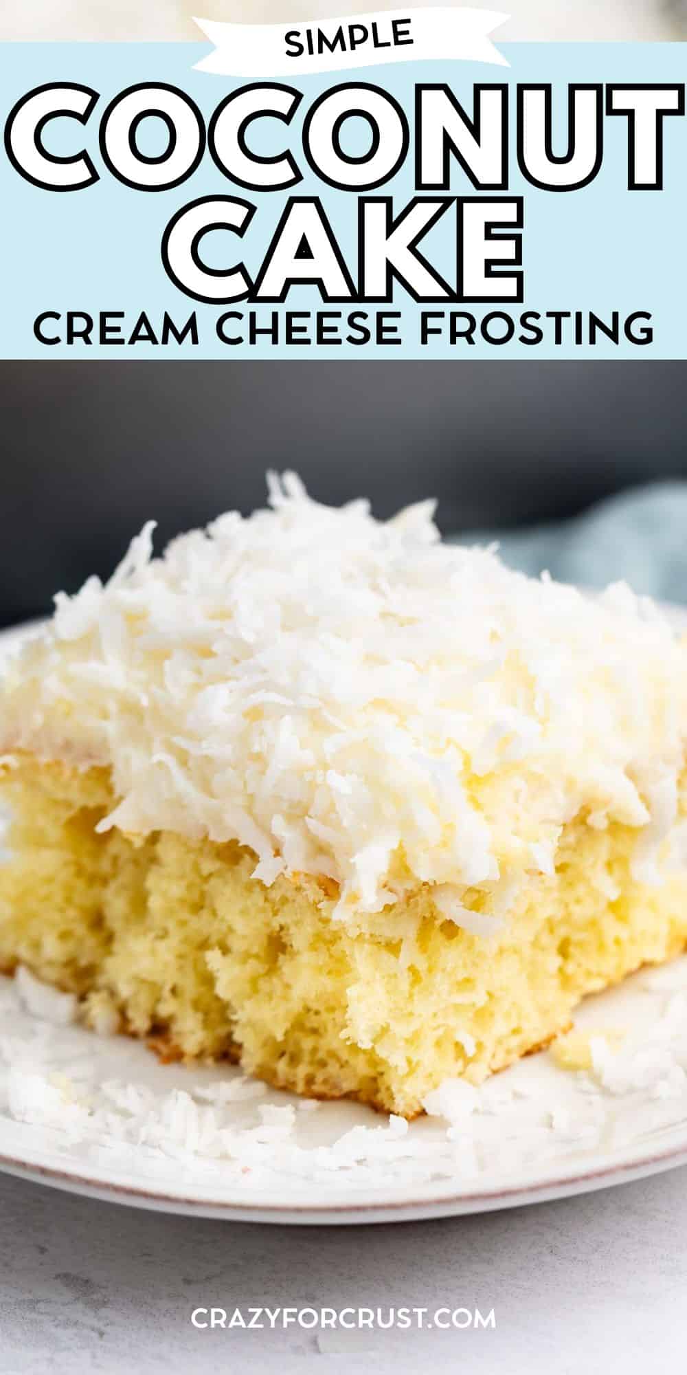 A slice of yellow coconut cake topped with cream cheese frosting and shredded coconut on a white plate. The image includes text promoting simple coconut cake with cream cheese frosting from crazyforcrust.com.