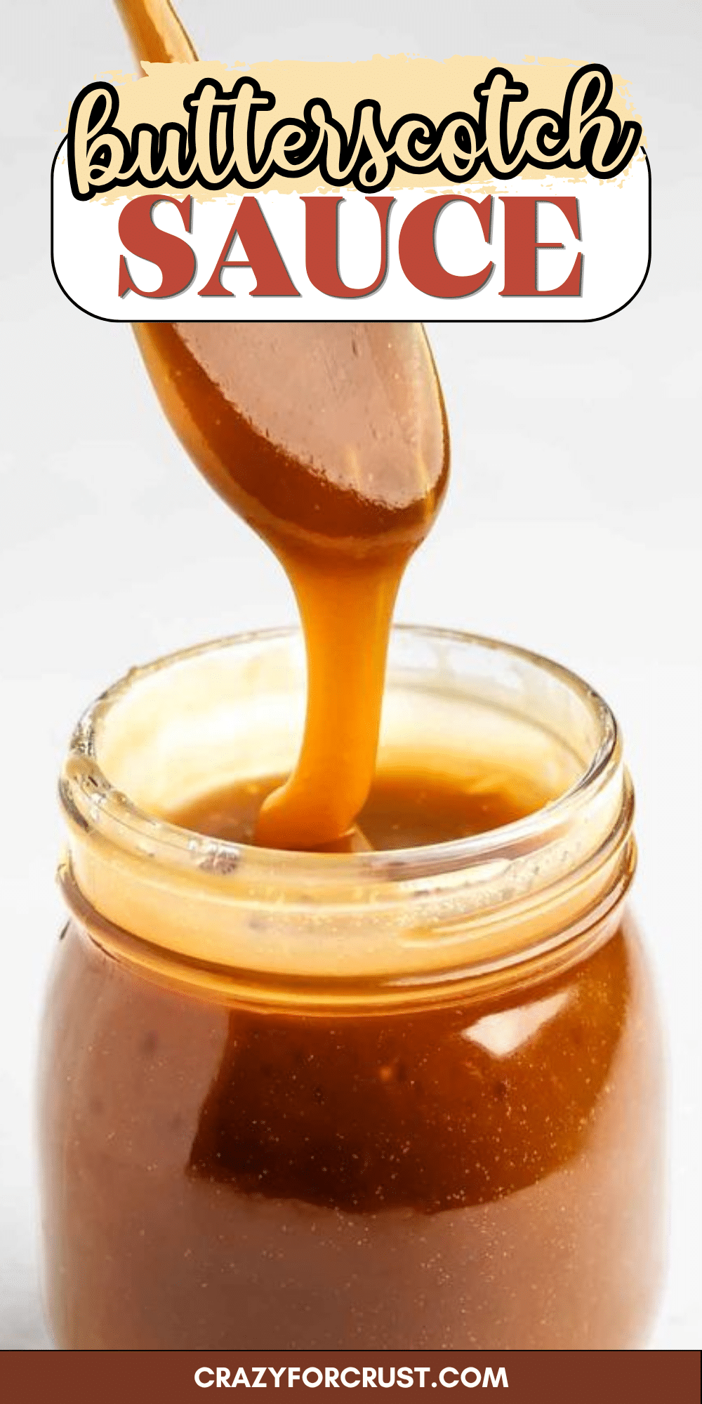 A wooden spoon drizzles thick, golden butterscotch sauce into a glass jar. The top of the image displays the text butterscotch sauce in decorative fonts.