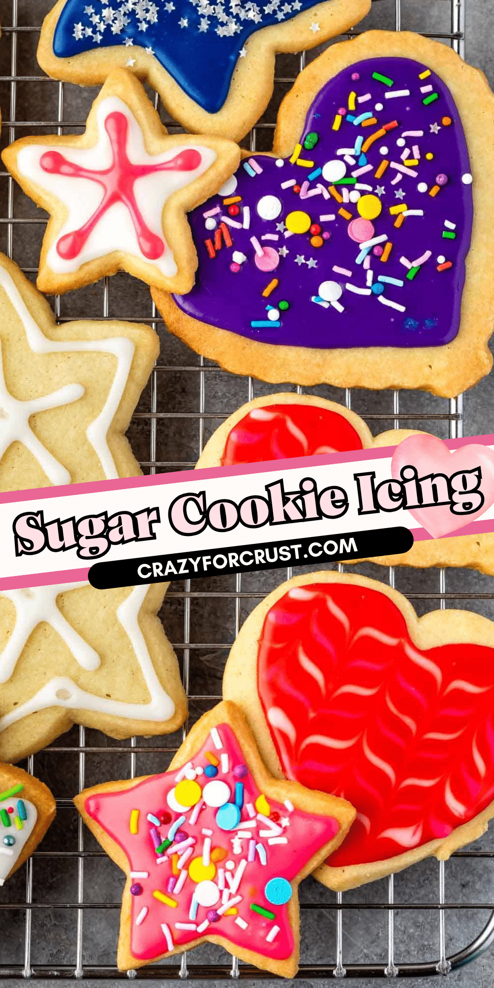 Colorful sugar cookies in star and heart shapes are decorated with vibrant icing and sprinkles, arranged on a cooling rack. A text overlay at the center reads, Sugar Cookie Icing CRAZYFORCRUST.COM.
