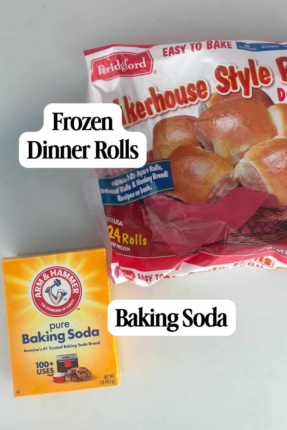 A package of Rhodes frozen dinner rolls and a box of Arm & Hammer pure baking soda are placed side by side on a white surface.