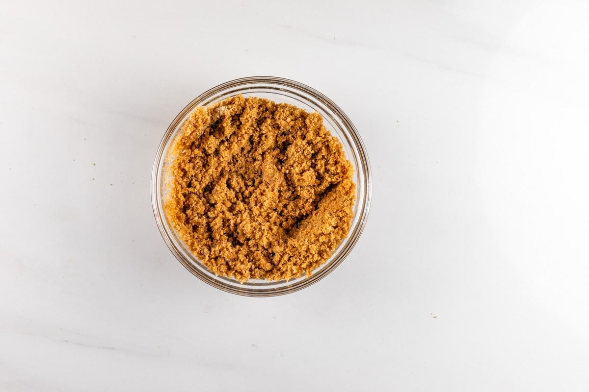A glass bowl filled with brown sugar.
